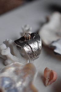Hand engraved silver ring with a rustic diamond