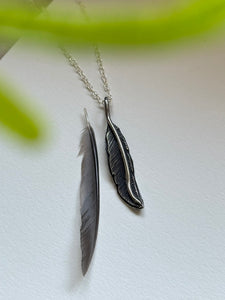 Hand-engraved sterling silver hummingbird pendant with a sterling silver chain.
