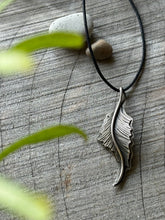 Load image into Gallery viewer, Hand-engraved sterling silver heron feather on balck cord.
