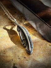 Load image into Gallery viewer, Hand -engraved raven feather on a starling silver chain.
