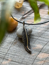 Load image into Gallery viewer, Hand-engraved sterling silver hummingbird feather on balck cotton cord.

