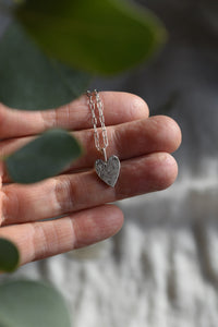 handcrafted silver heart pendant necklace. Hand engraved flower and a hummingbird