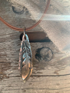 silver feather with a rawhide leather necklace for men